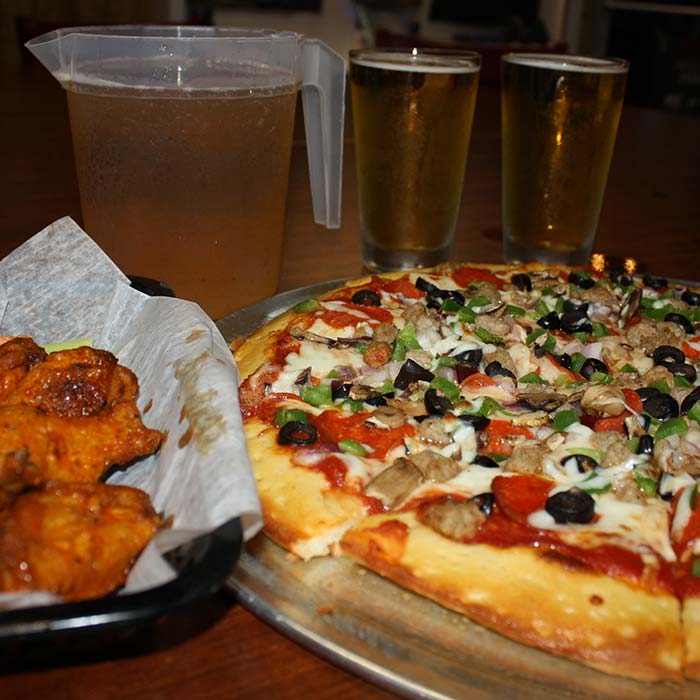 FUBAR Pizza Bar restaurant pizzeria in Fort Walton beach, Florida supreme pizza, basket of chicken wings and pitcher of beer FUBAR Pizza Bar restaurant pizzeria in Fort Walton beach, Florida supreme pizza, basket of chicken wings and pitcher of beer